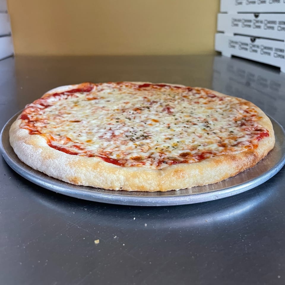A freshly baked Vito's Bistro cheese pizza with a golden crust on a metal pan.