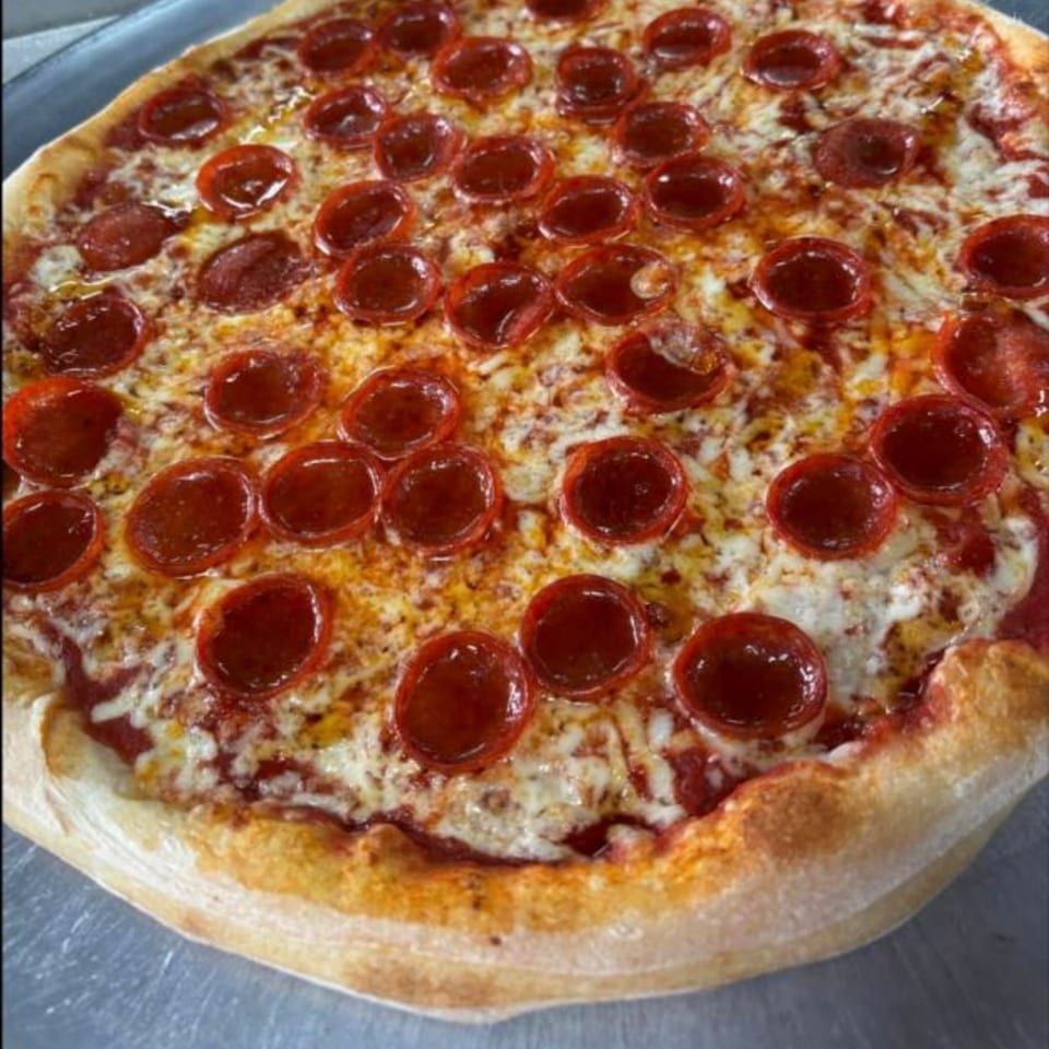 A large, round pepperoni pizza from Vito's Bistro, with melted cheese and a golden crust.